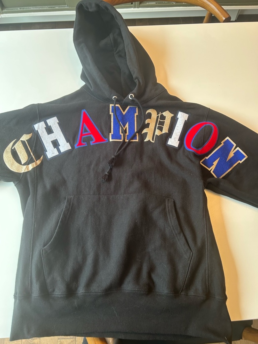 Champion Black Hoodie with Blue and Gold Accent
